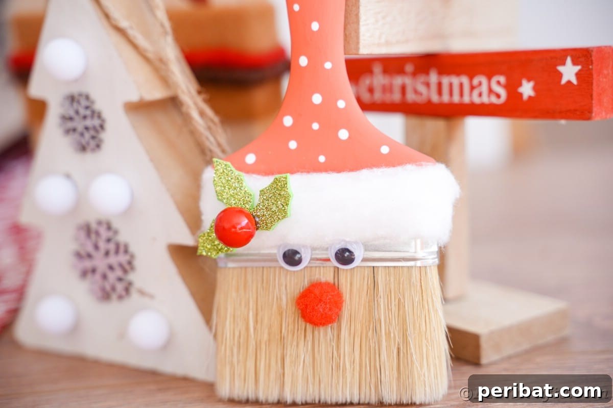 A charming Santa Claus paintbrush decoration displayed on a table, ready to bring festive cheer to any home.