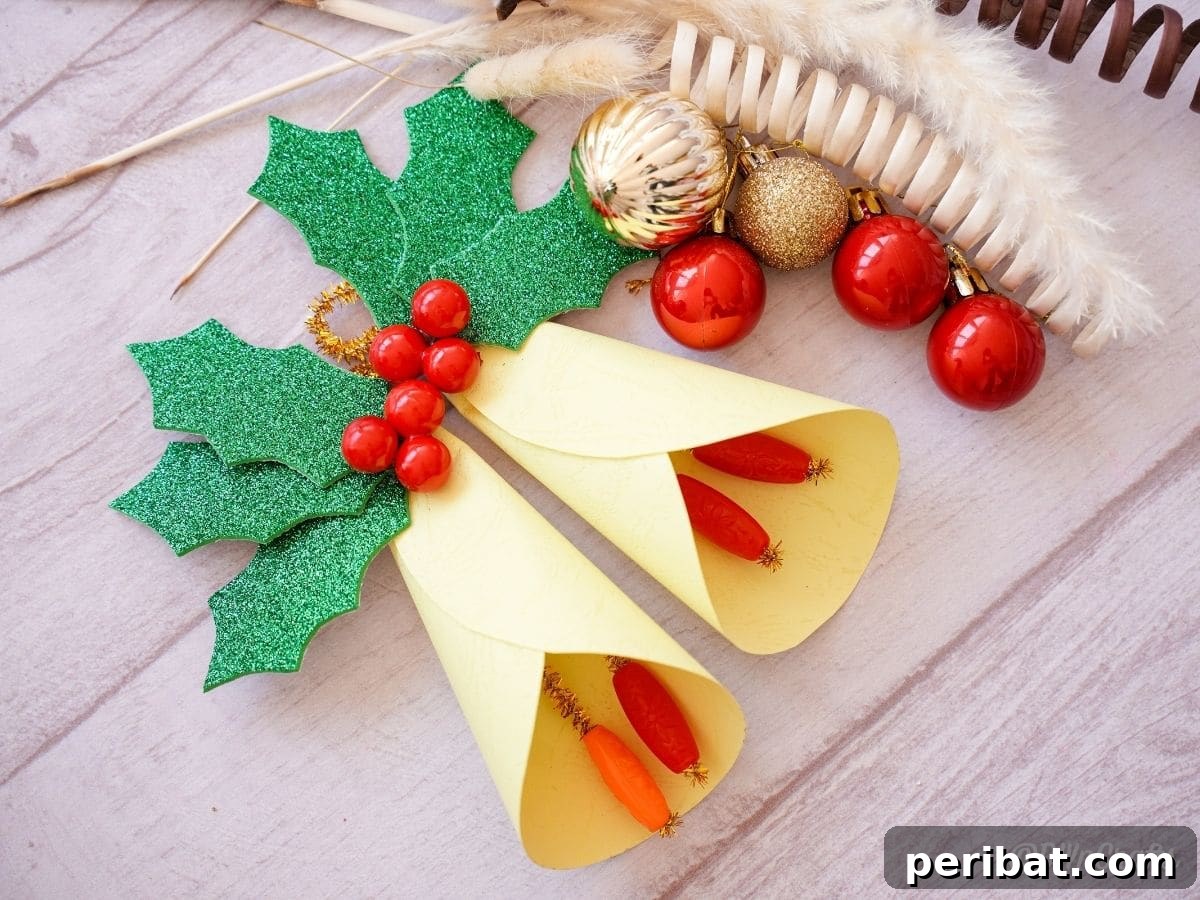 Handcrafted Paper Holly Christmas Ornament 3 paper holly ornament on a table with red decorative balls, highlighting festive colors
