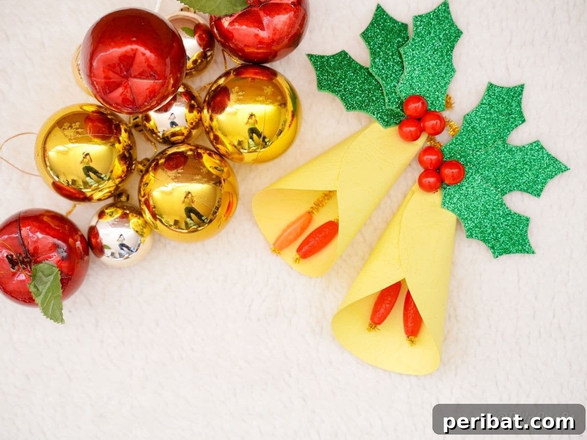 Handcrafted Paper Holly Christmas Ornament 11 christmas ornaments on white table next to fake holly, offering styling ideas