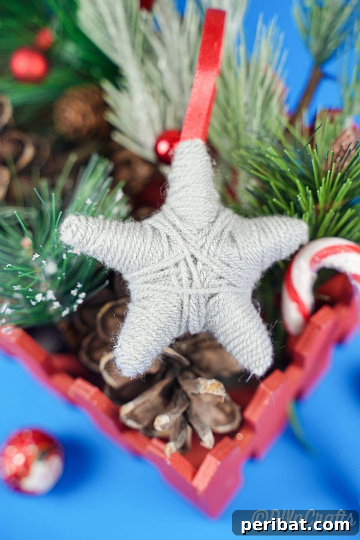 Charming Rustic Yarn Star Tree Ornament 4 gray and red yarn ornament in holiday decor basket
