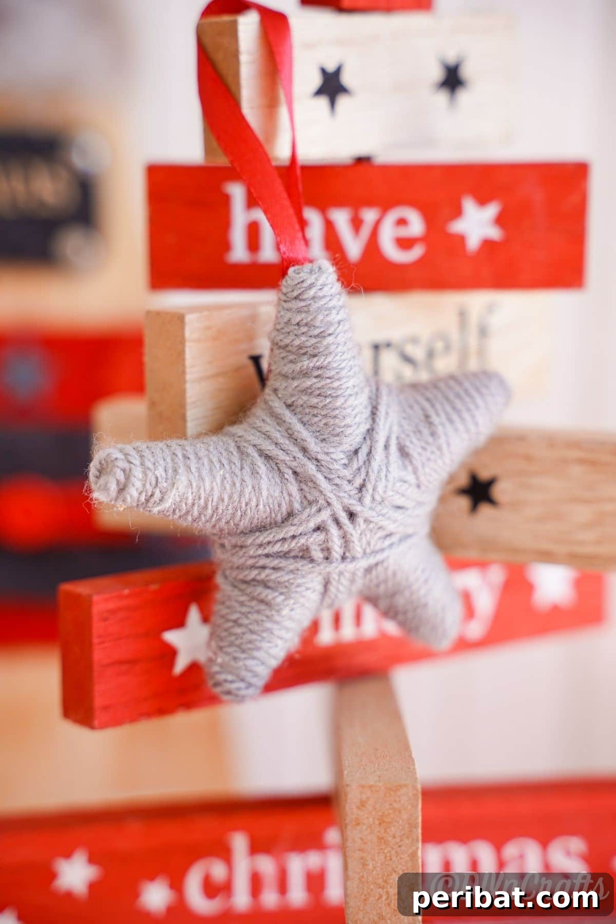 Charming Rustic Yarn Star Tree Ornament 6 wood christmas saying tree with gray star hanging on edge