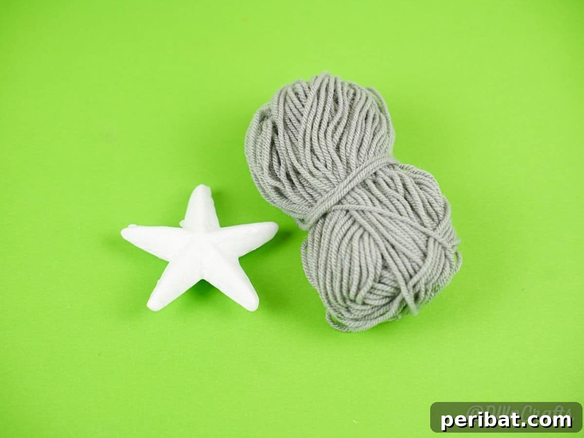 Charming Rustic Yarn Star Tree Ornament 7 gray yarn and white star on green table