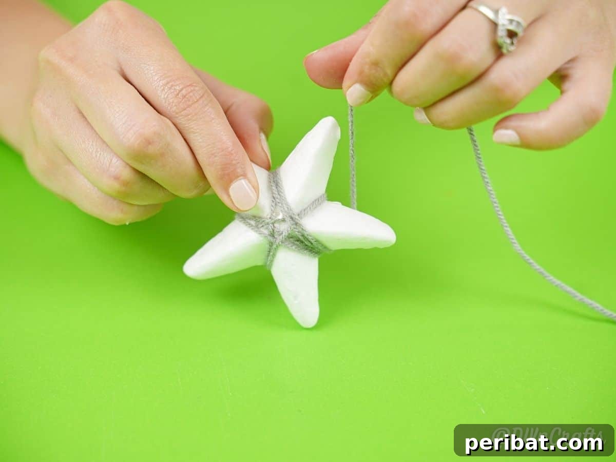 Charming Rustic Yarn Star Tree Ornament 8 hand wrapping yarn around white star