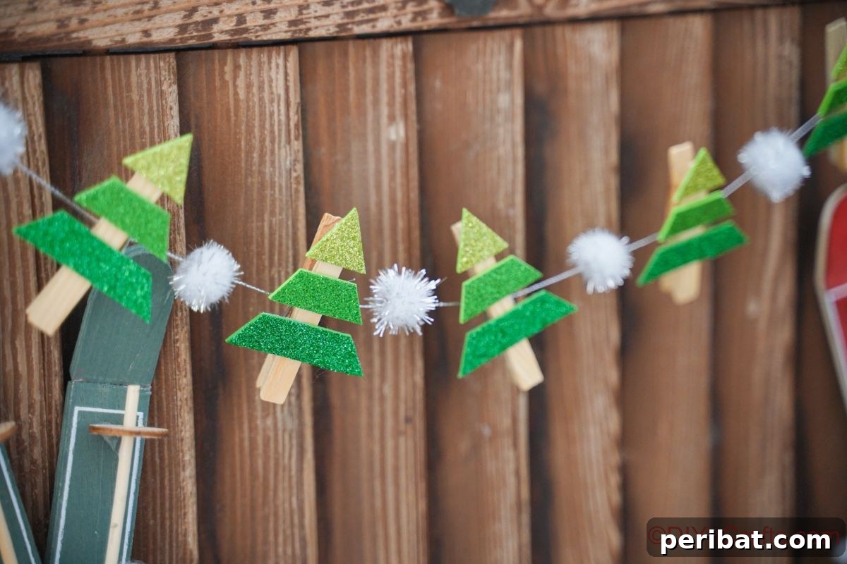 mini christmas tree garland hanging on wood wall
