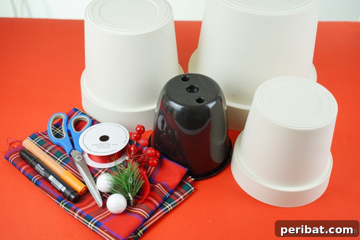 Arrangement of white flower pots and various craft supplies neatly laid out on a vibrant red table