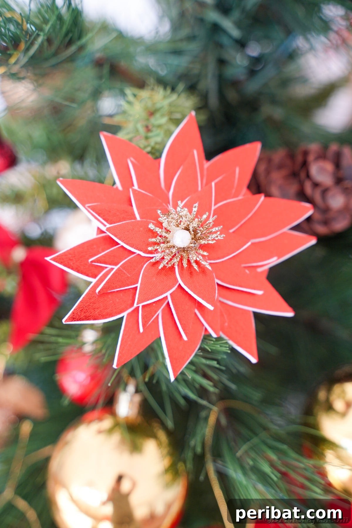 Craft Your Own Foam Poinsettia Brooch or Festive Ornament 2 Poinsettia ornament hanging on holiday tree