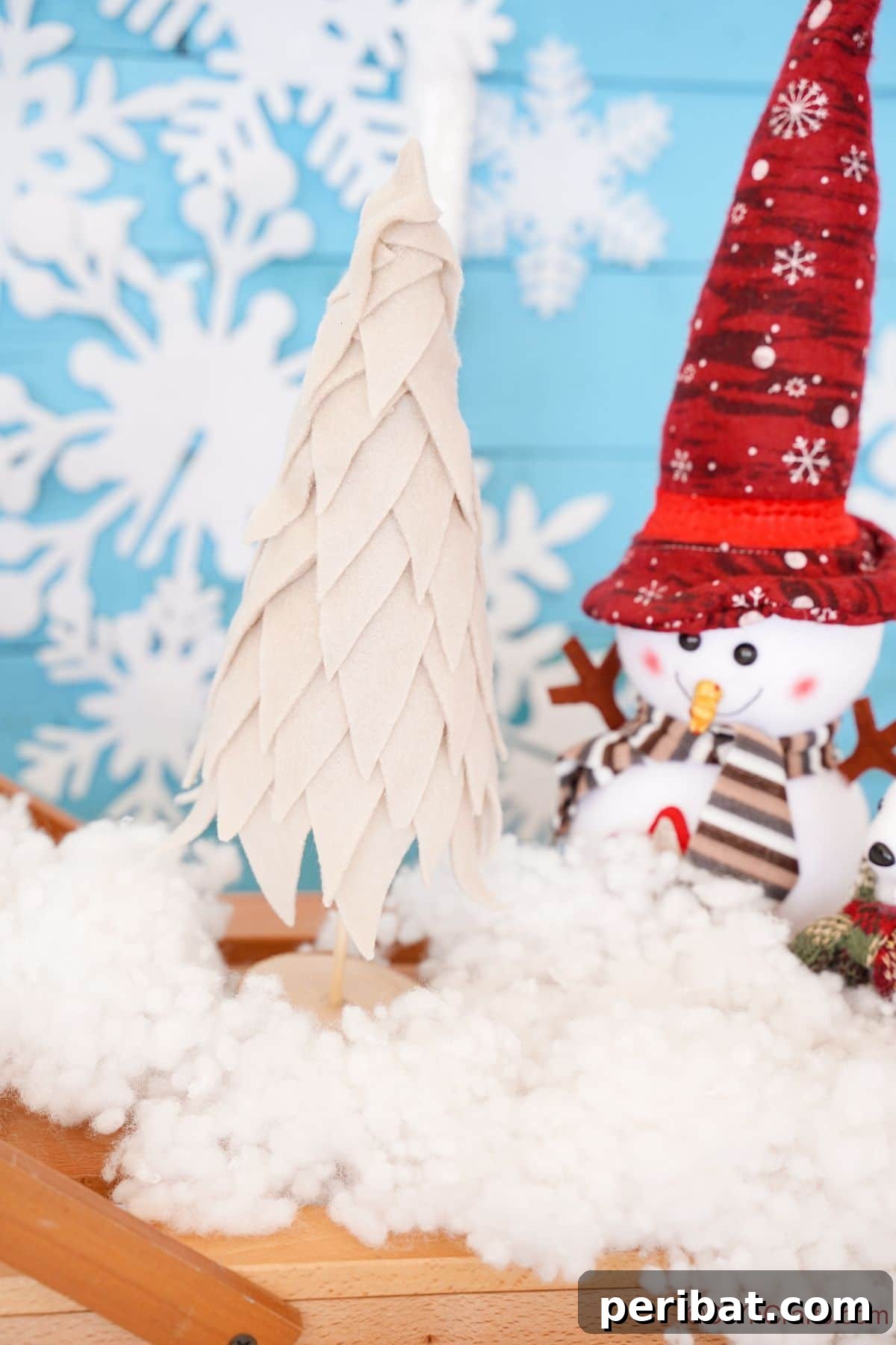 Cozy Upcycled Sweater Christmas Tree 16 mini fabric tree on table with fake snow and fake snowman toy