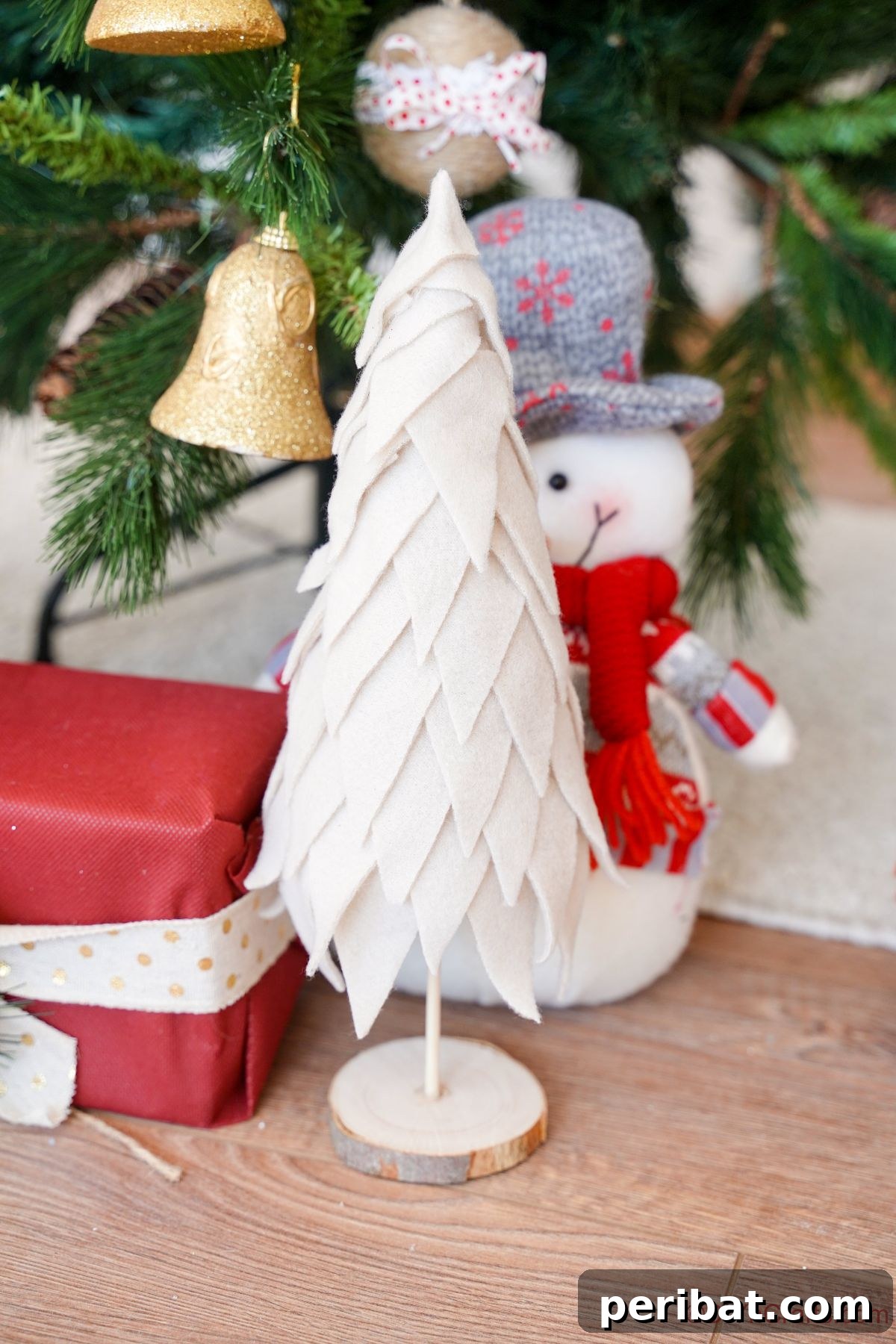 Cozy Upcycled Sweater Christmas Tree 4 miniature fabric Christmas tree sitting on wood floor by real christmas tree