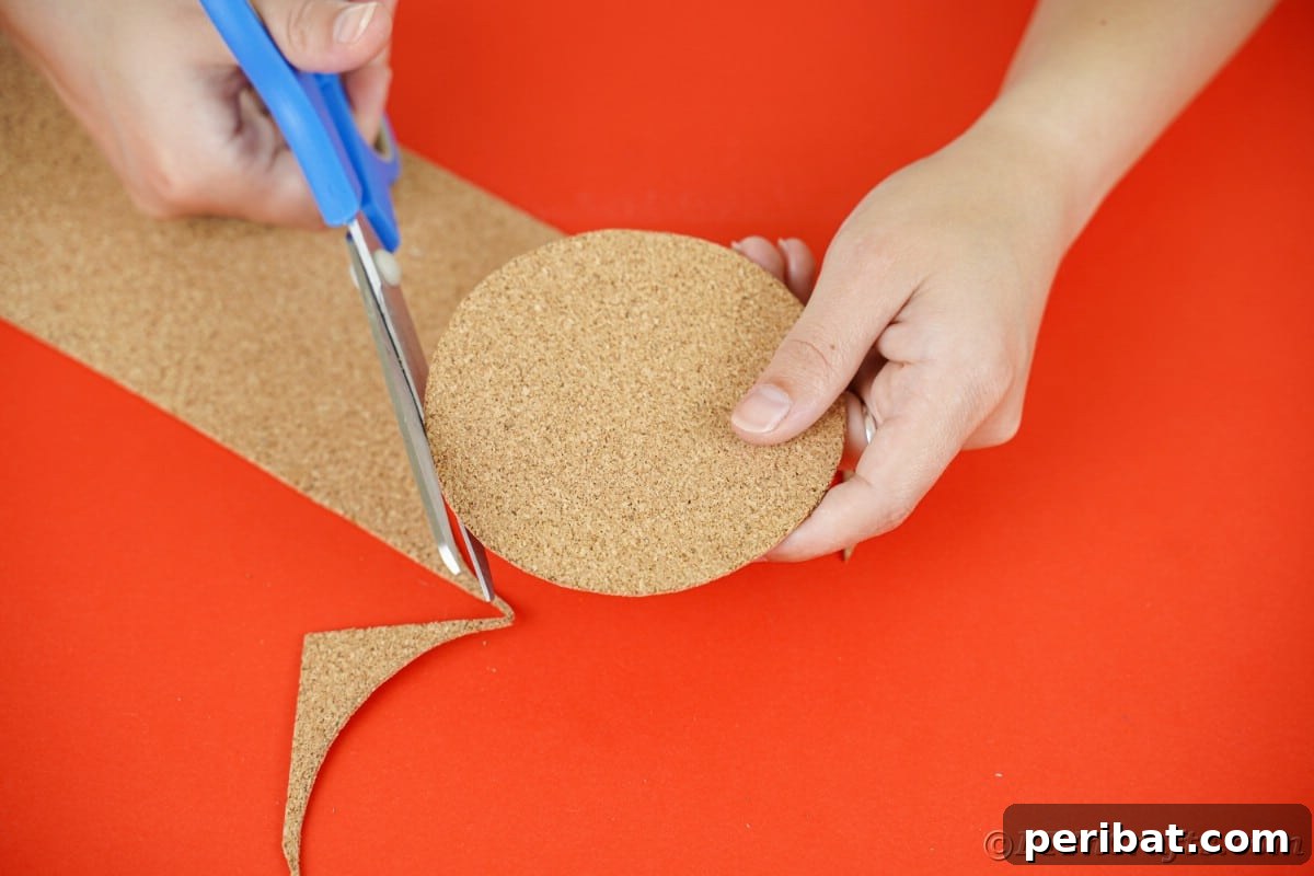 blue scissors cutting out cork round