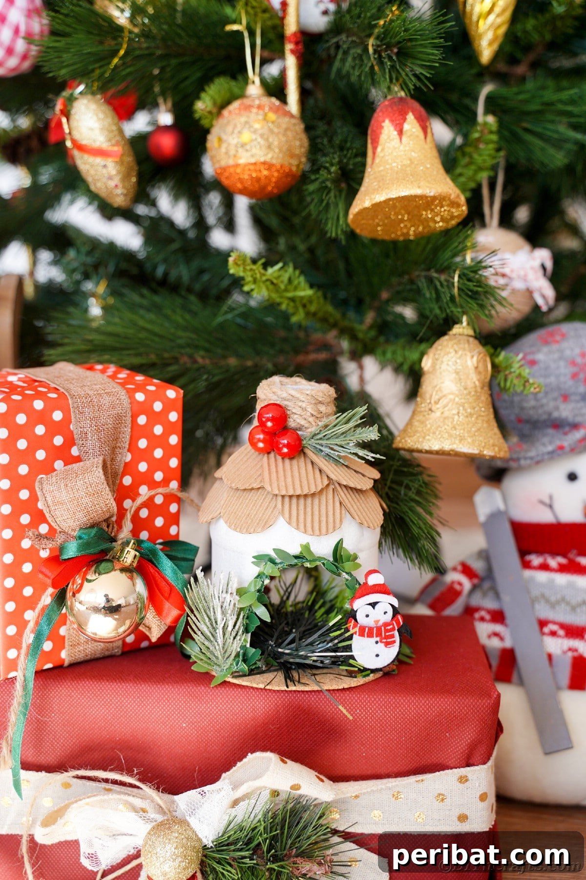 Arctic Home Crafted from Upcycled Plastic 30 Christmas tree with bell ornaments in background with red and white polka dot and solid red boxes in front of tree