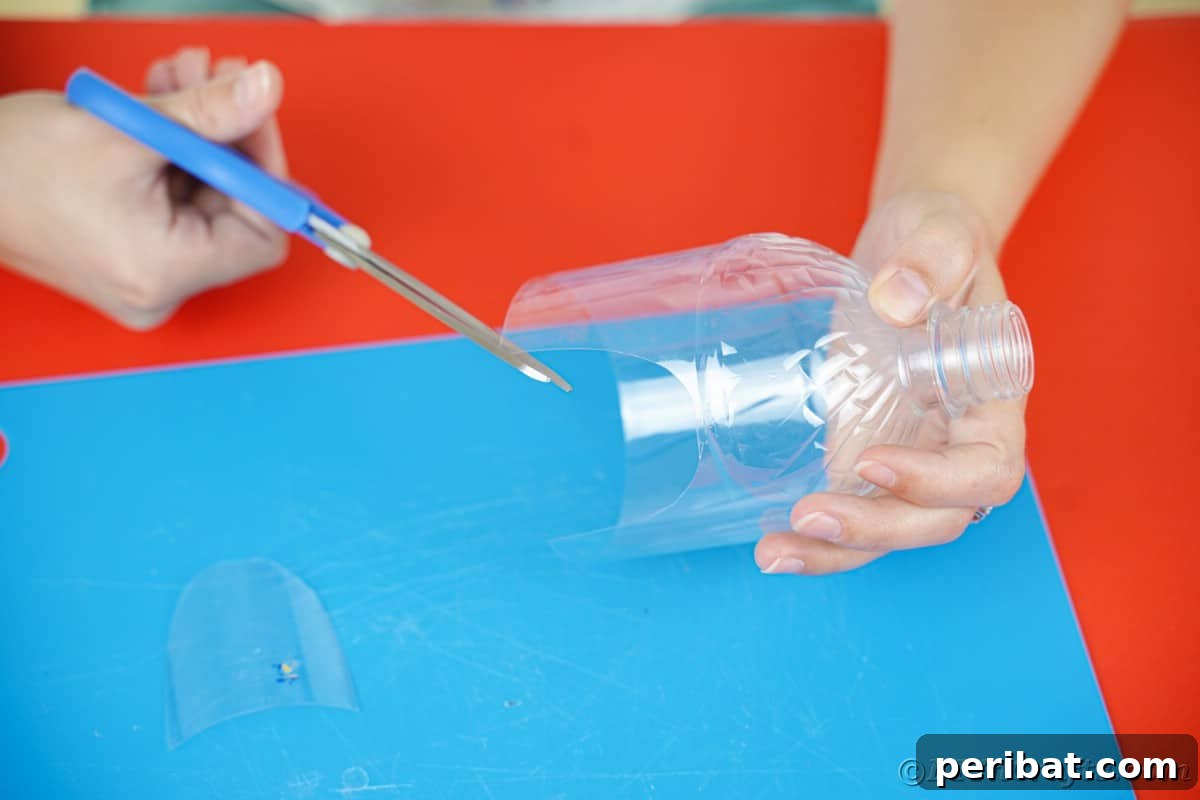 blue scissors being used to cut doors on side of plastic bottle