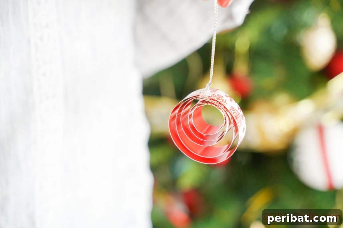 Layered Rolled Paper Christmas Charm 15 red and white paper ornament hanging on christmas tree