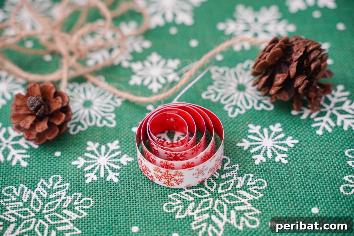 Layered Rolled Paper Christmas Charm 3 round rolled paper ornament on snowflake patterned green paper