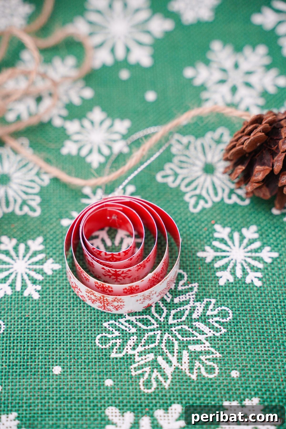 Layered Rolled Paper Christmas Charm 16 green and white snowflake paper with red round ornament on top