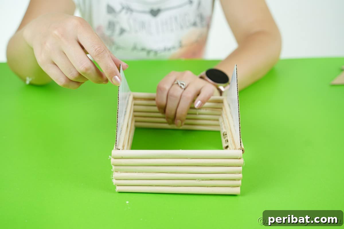 lady gluing ends onto house