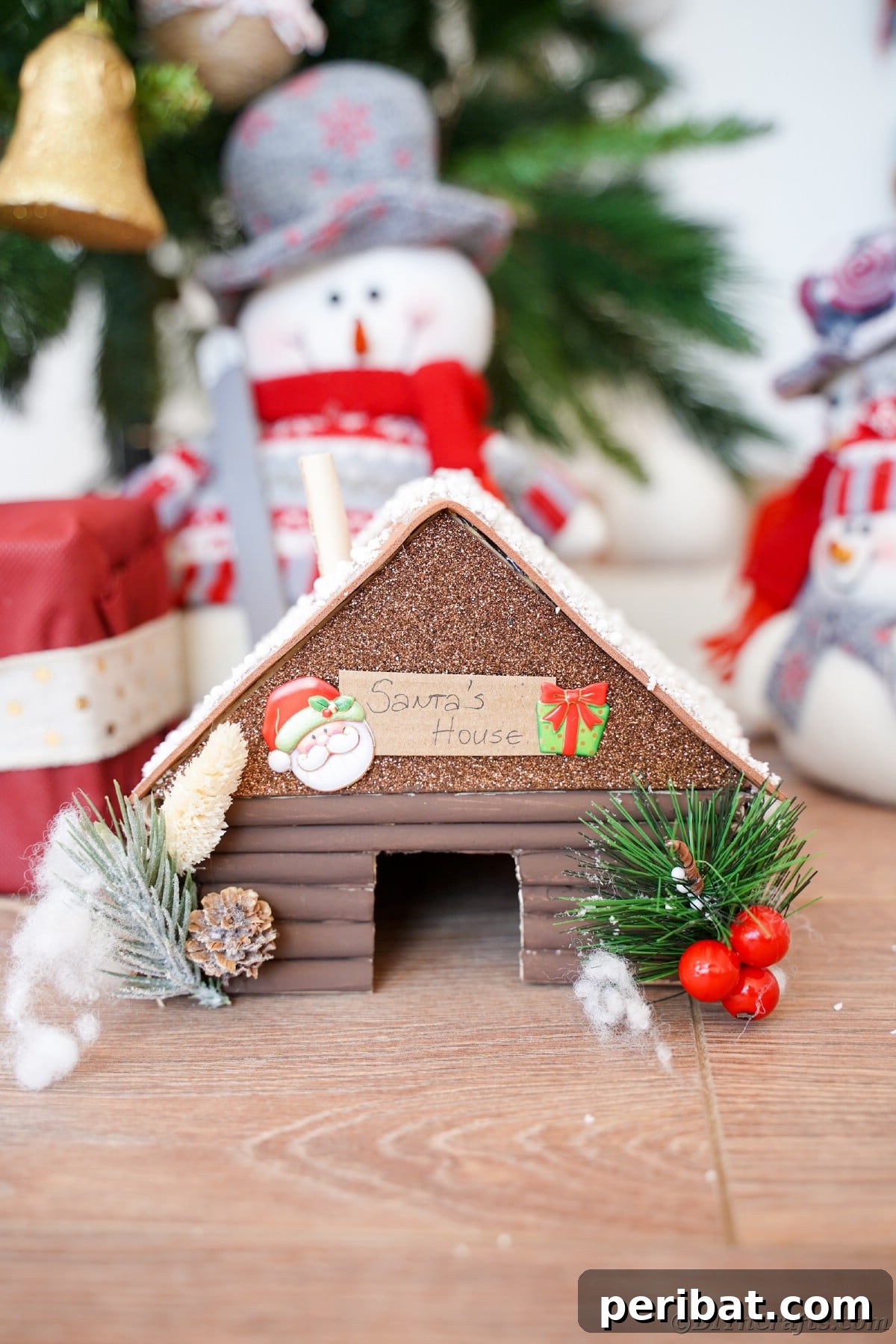 brown fake log mini cabin on table by holiday gifts