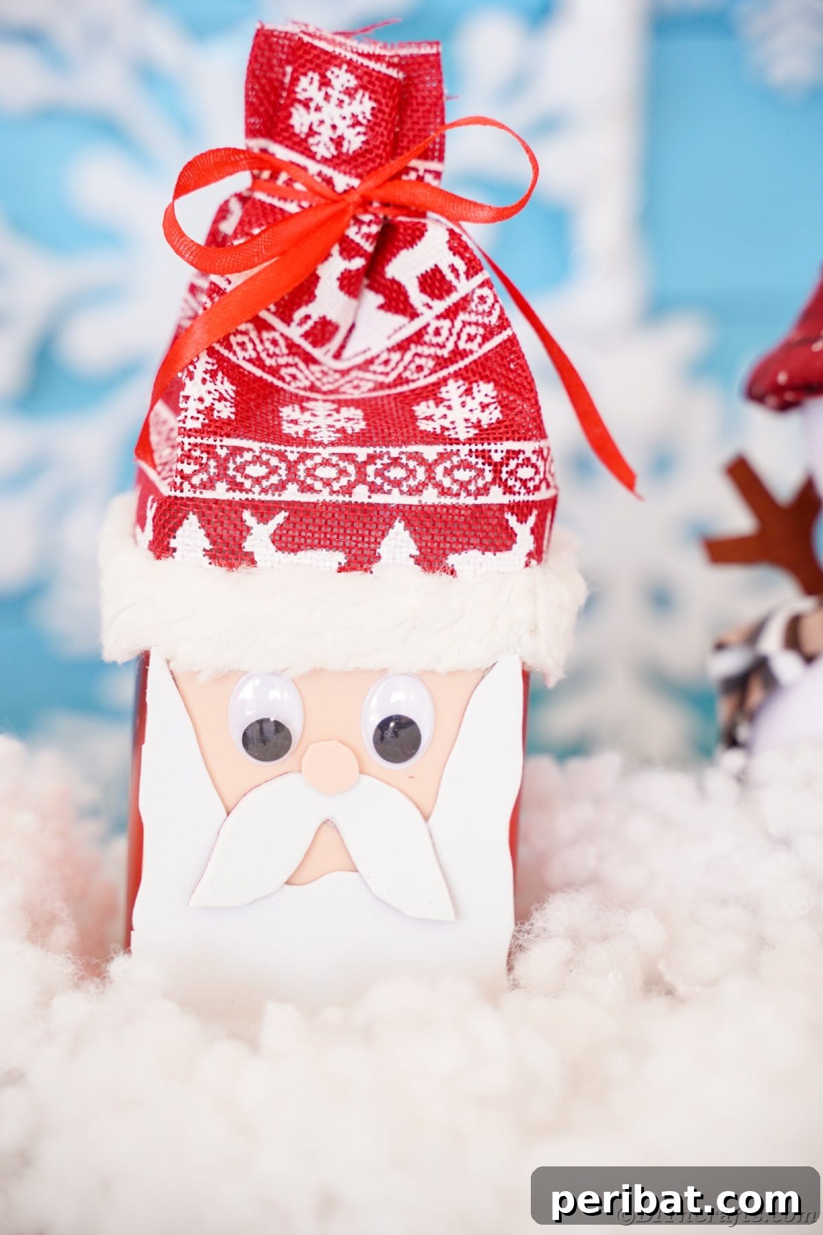 Jolly Upcycled Milk Carton Santa Candy Box 22 Foam Santa face on a box with a Nordic hat, sitting on fake snow, highlighting the detailed features