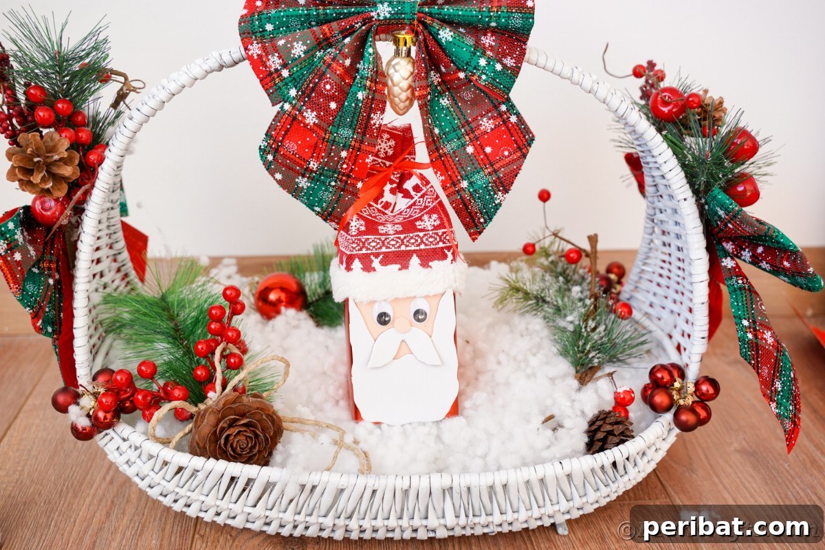 Jolly Upcycled Milk Carton Santa Candy Box 5 White basket filled with fake snow, artificial berries, and a miniature Santa Claus head