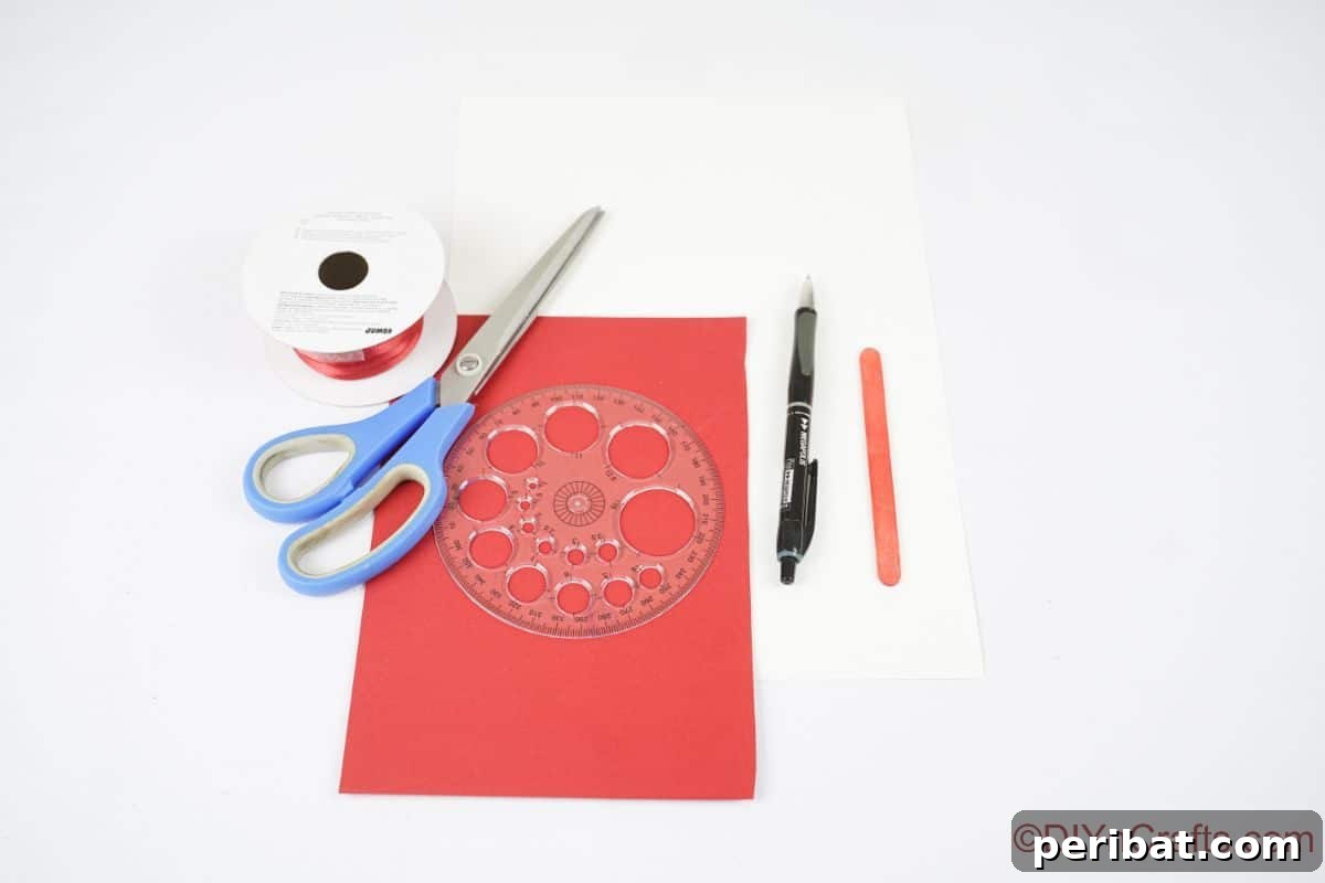 Sweet Peppermint Stick Decor 9 Red paper, blue scissors, and red ribbon on a white table, illustrating the basic supplies for the craft.