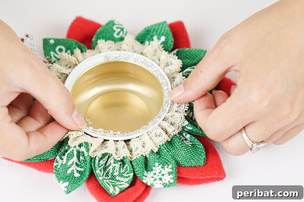 Festive Fabric Floral Candle Centerpiece 13 hand holding lace on top of candle holder