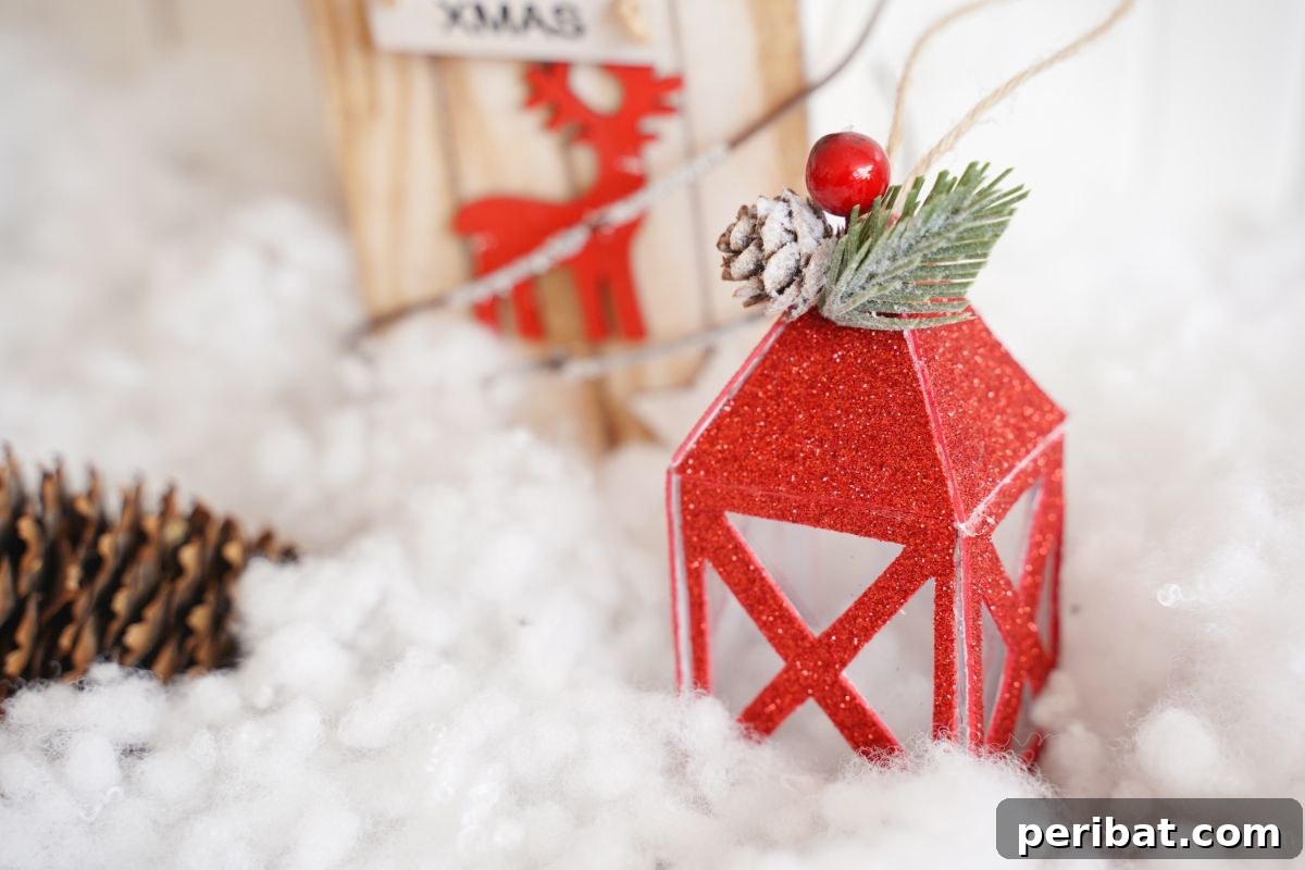 mini paper lantern in front of wood house with fake snow