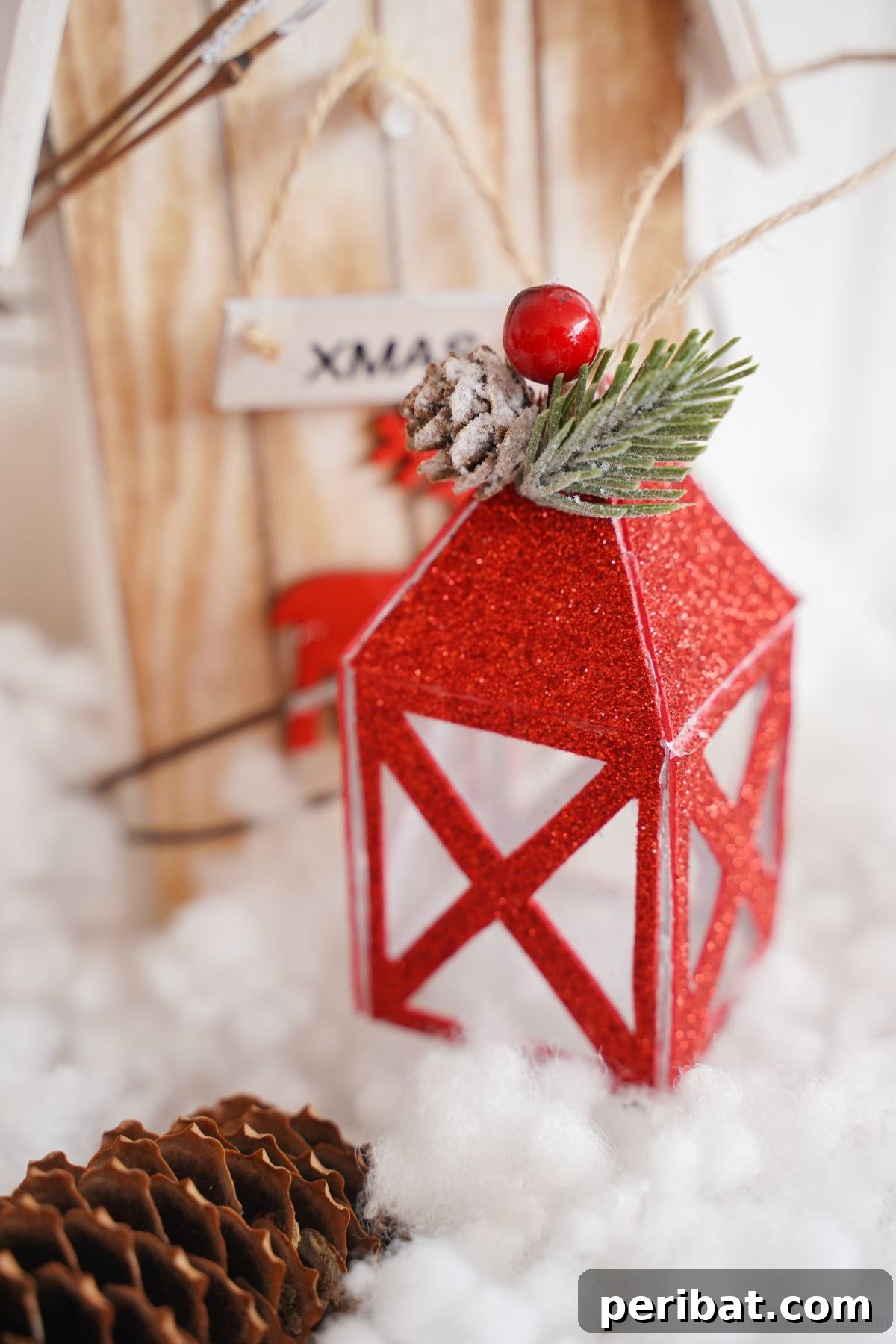 wood bird house on fake snow by mini red lantern