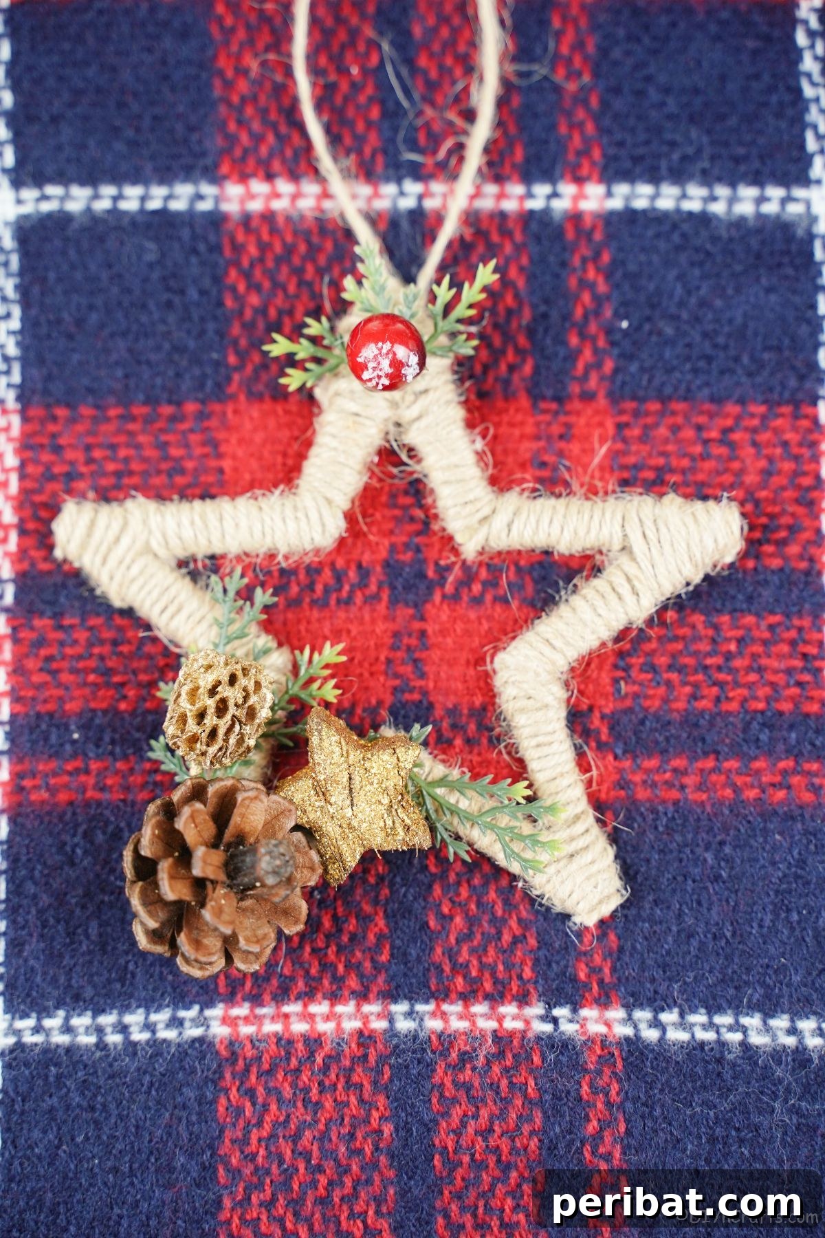 A rustic star ornament placed on a cozy plaid fabric, highlighting its handmade charm.