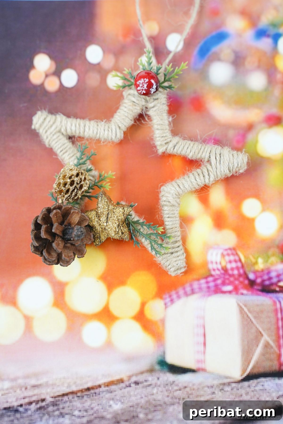 A star Christmas ornament made from twine, hanging on a fake tree, ready for holiday celebrations.