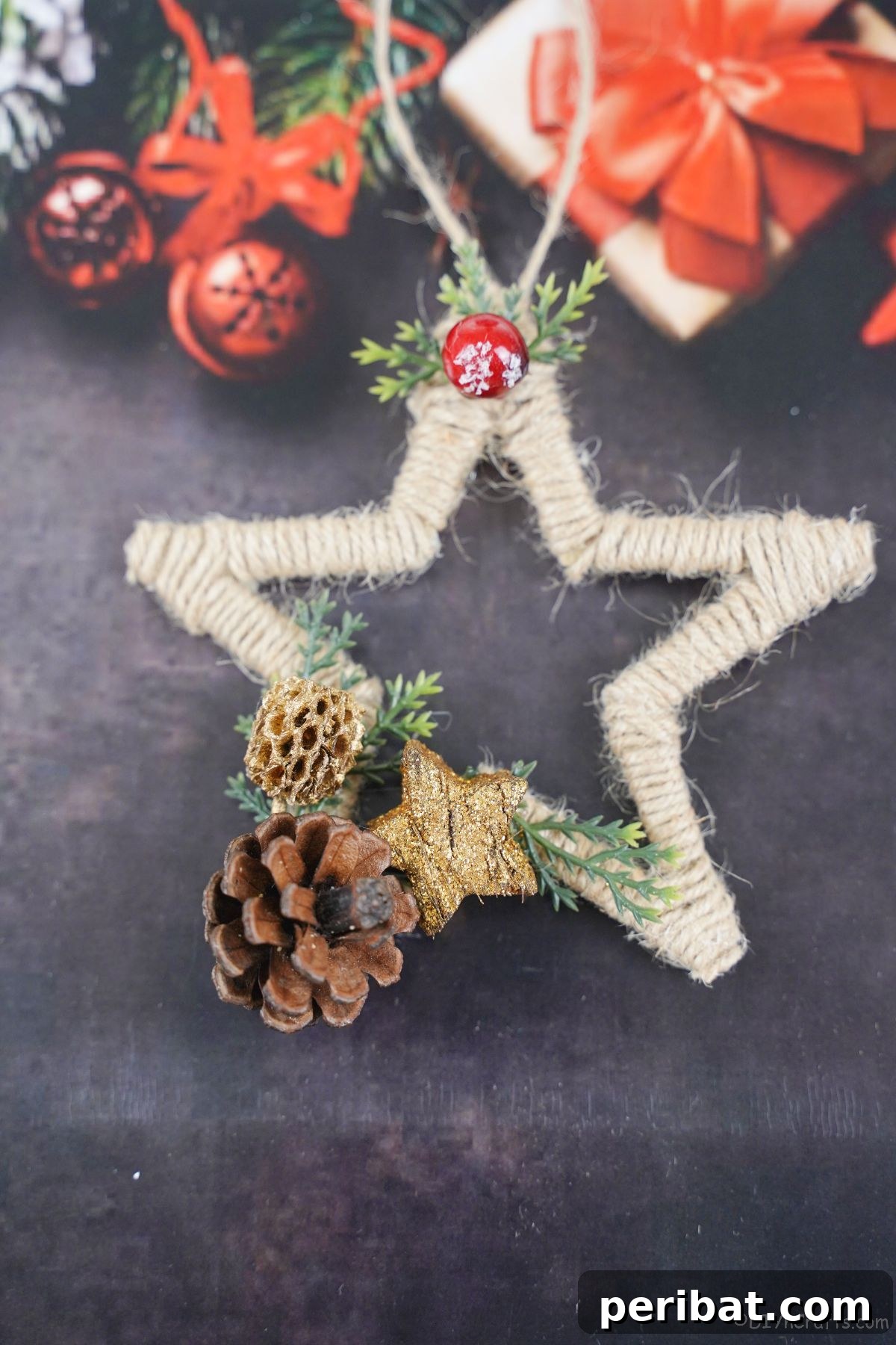 Twine-wrapped star ornament resting gracefully on black holiday wrapping paper with subtle patterns.