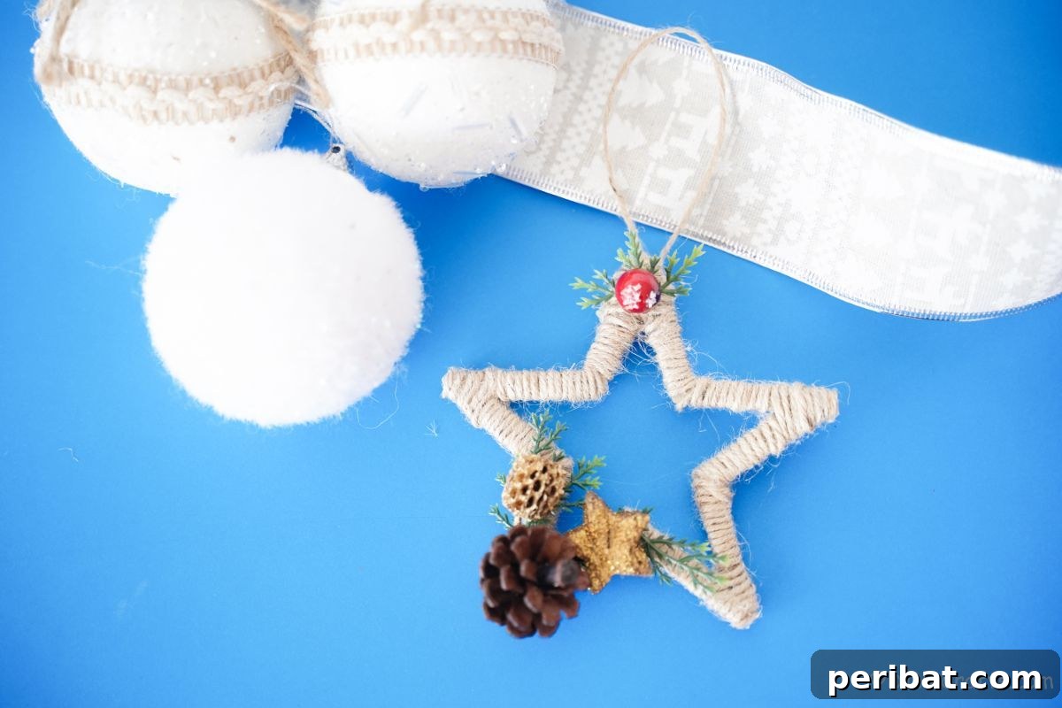 A beautifully crafted twine-wrapped star ornament displayed on a vibrant blue table, ready for further decoration.