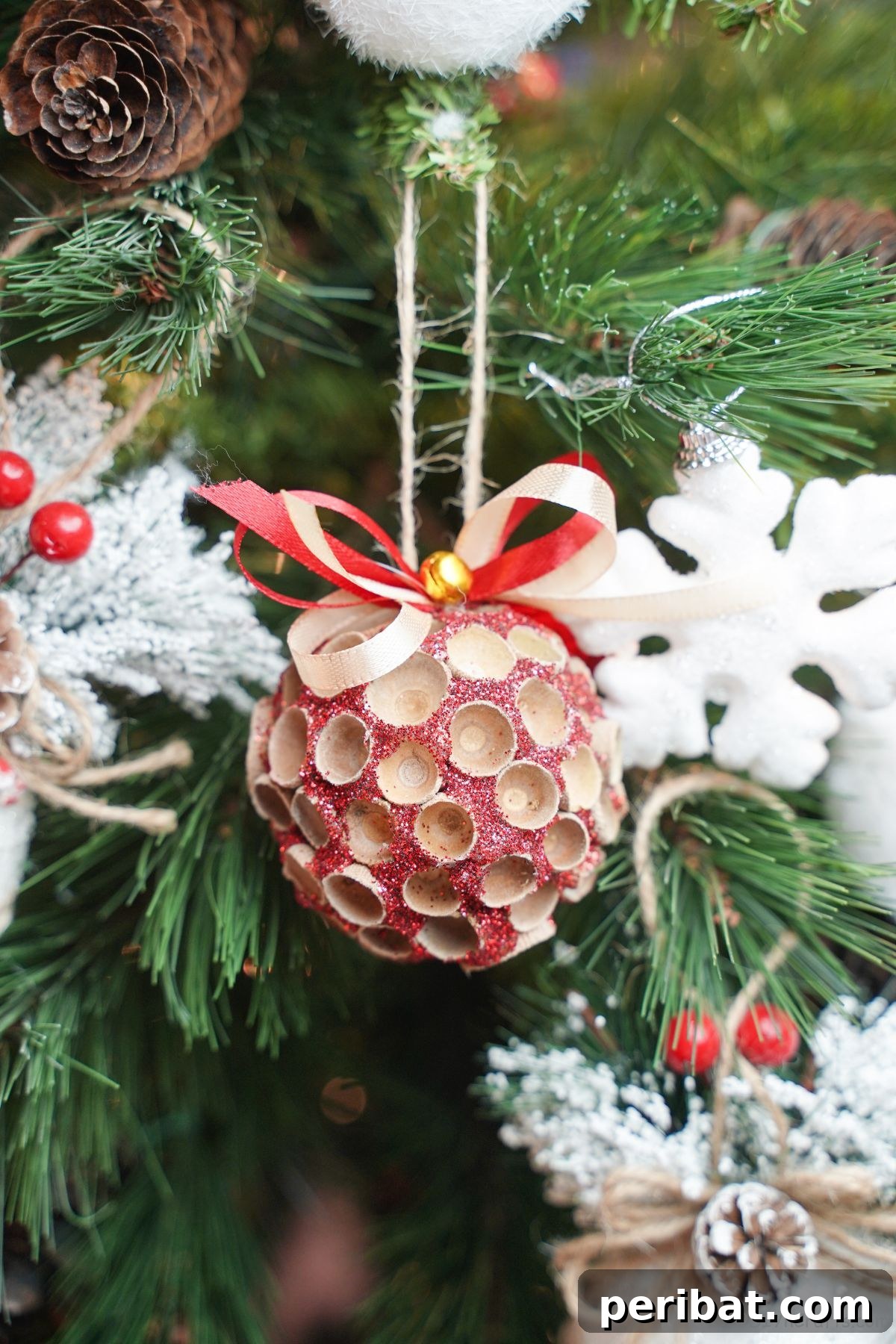 Handcrafted Sparkling Acorn Cap Christmas Ornament 19 acorn cap ornament hanging in christmas tree
