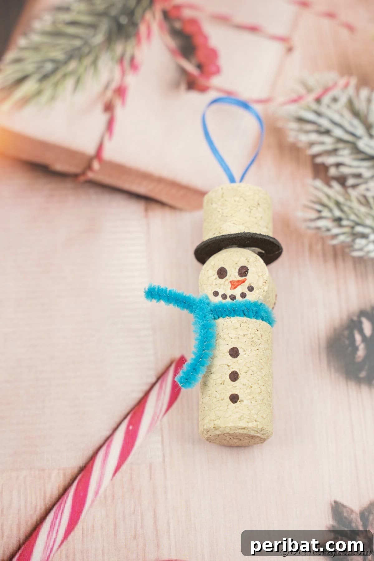 wine cork snowman ornament on holiday table paper