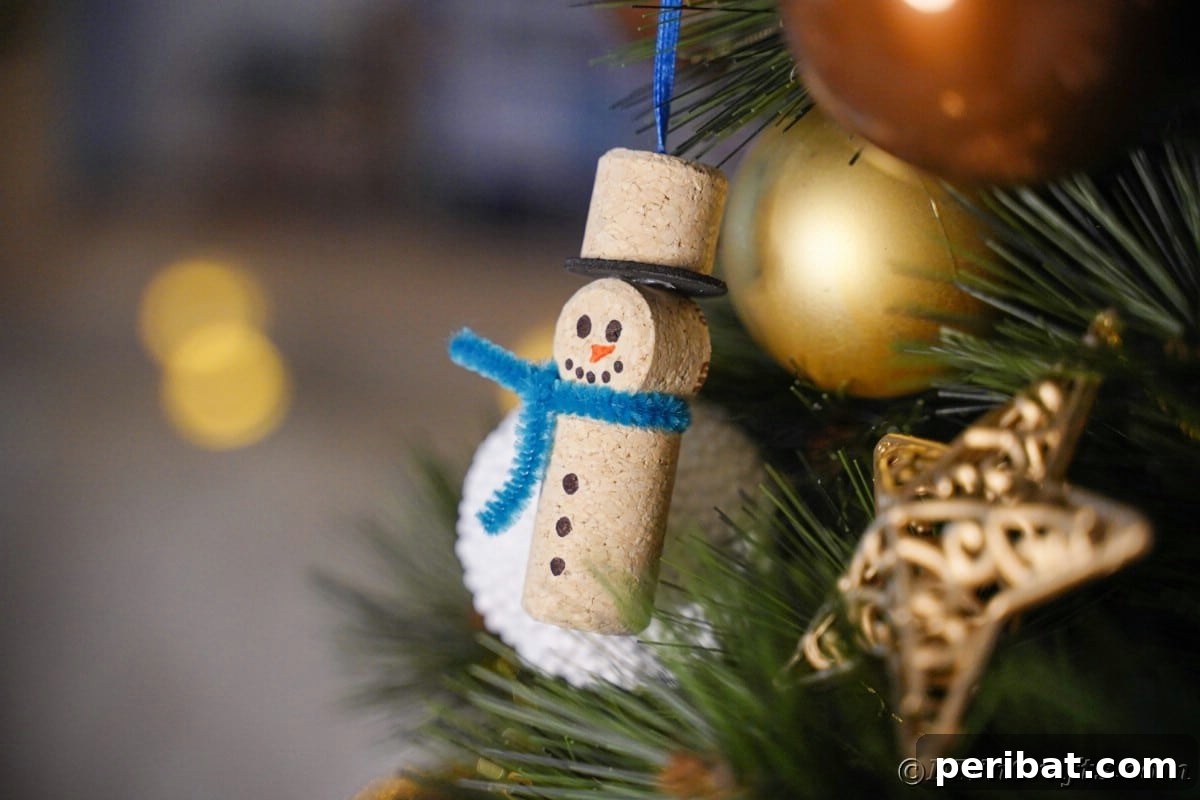 wine cork ornament on tree by gold ball