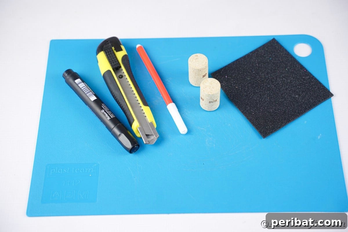 markers corker felt and craft knife on blue paper