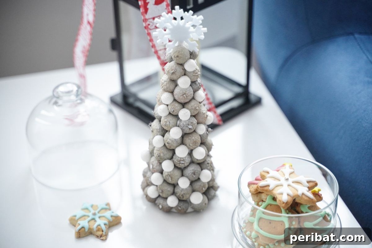 white mini tree on side table by black lantern