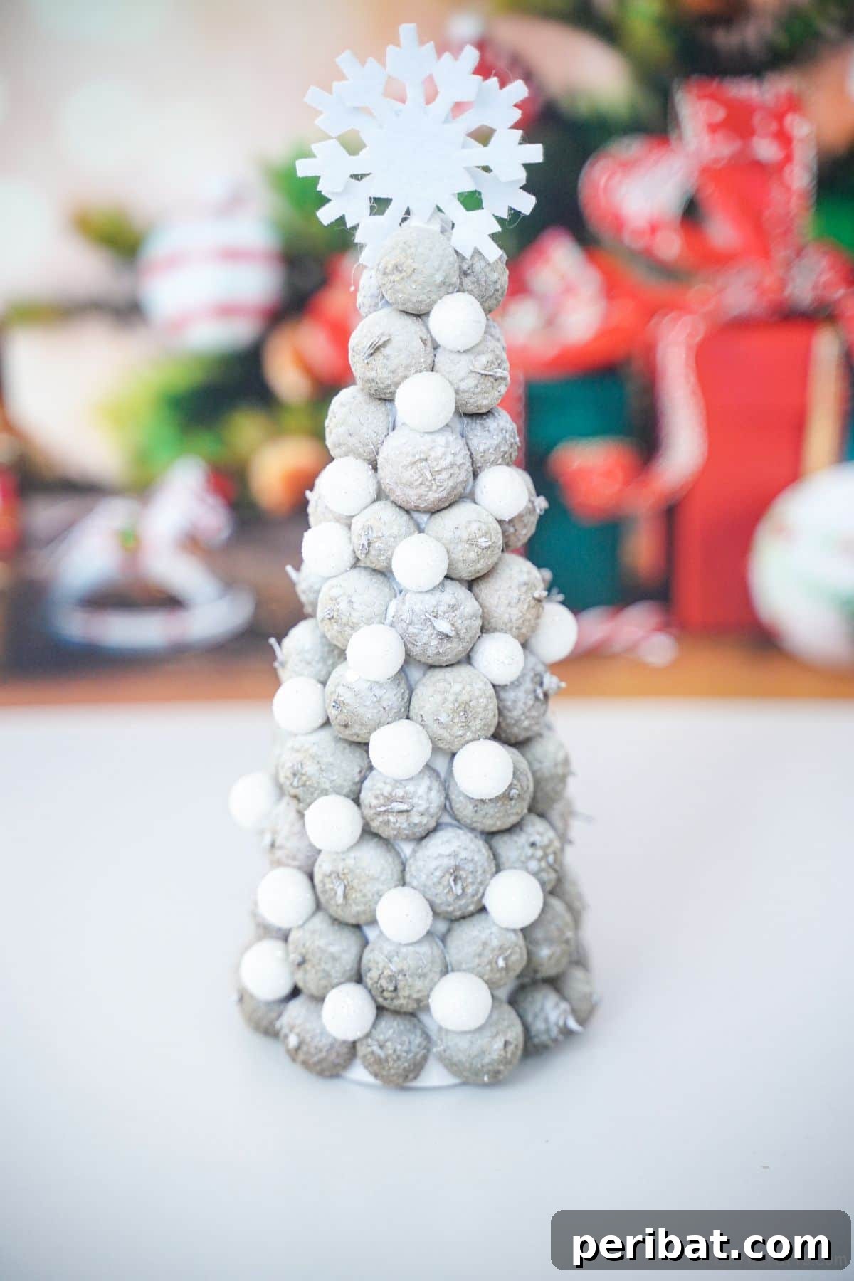 white acorn cap tree on white table with holiday background
