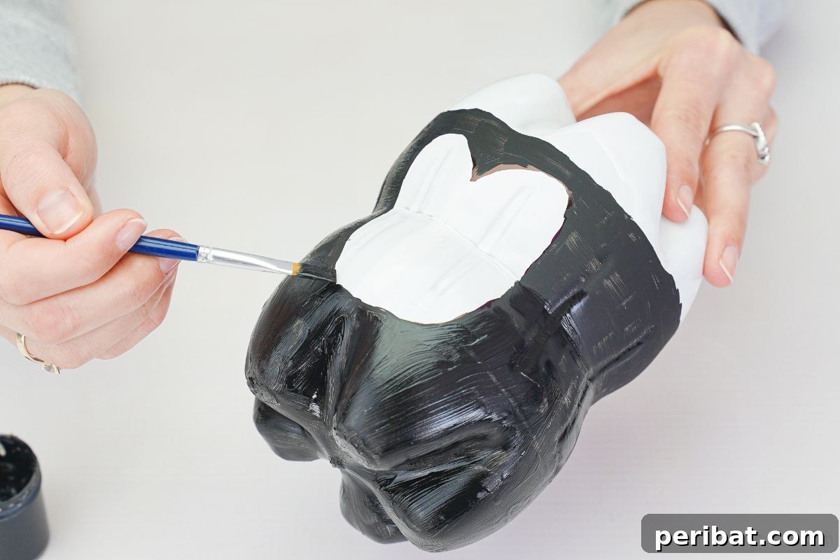 Upcycled Plastic Bottle Penguin Craft for Kids 14 hand painting black body on penguin