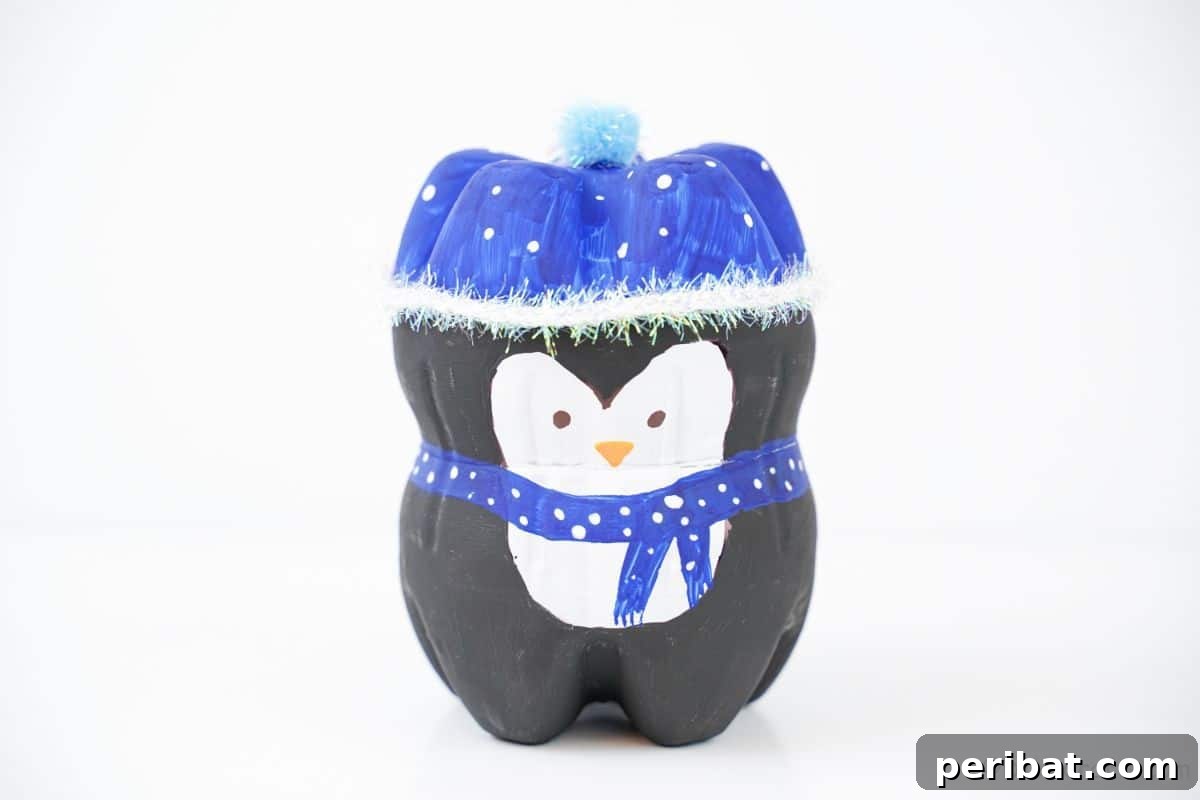 Upcycled Plastic Bottle Penguin Craft for Kids 3 penguin craft on white table