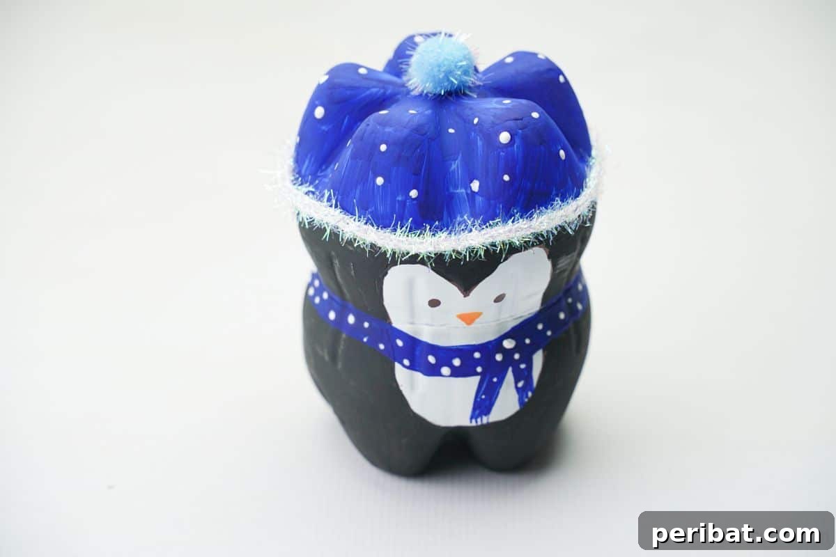 Upcycled Plastic Bottle Penguin Craft for Kids 7 upcycled bottle penguin on white table