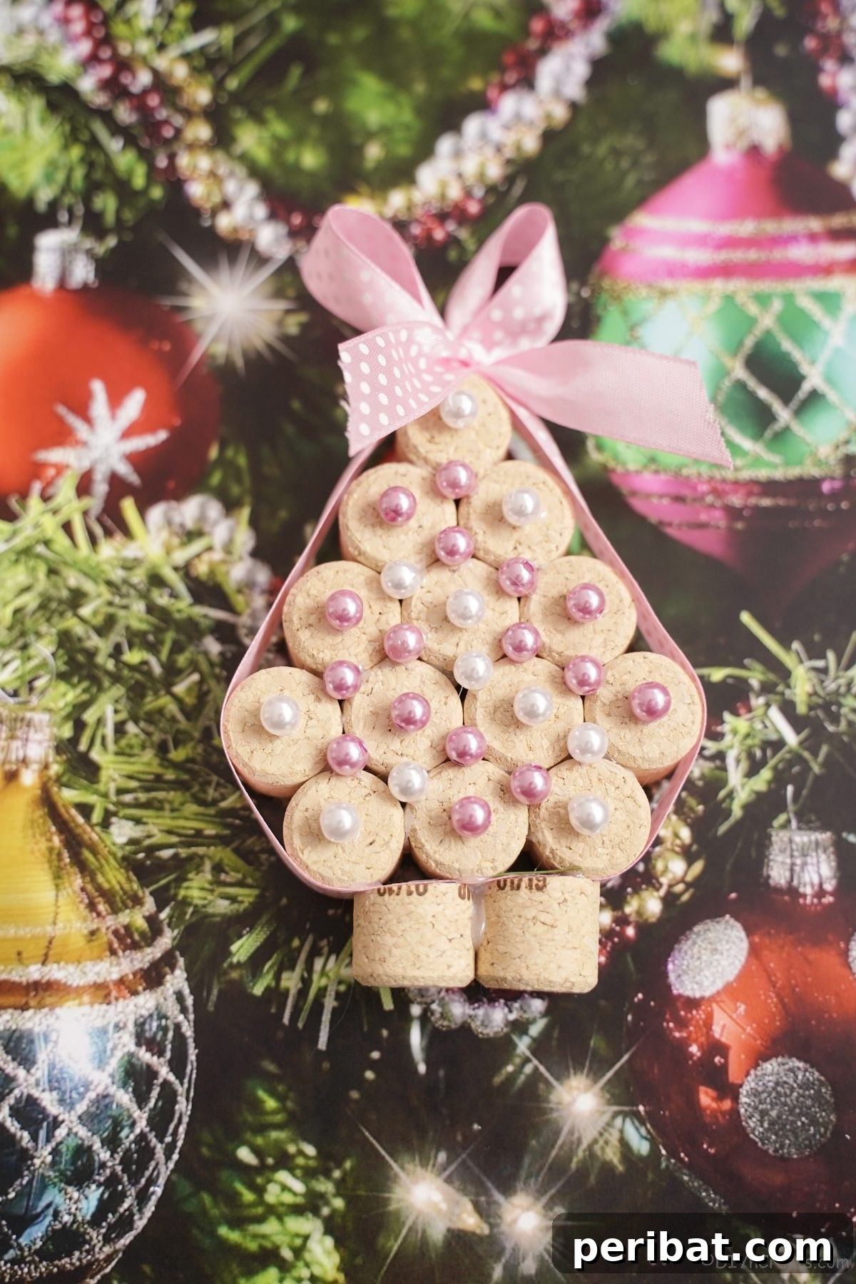 miniature cork tree with pink beads on holiday paper, ready to brighten any space