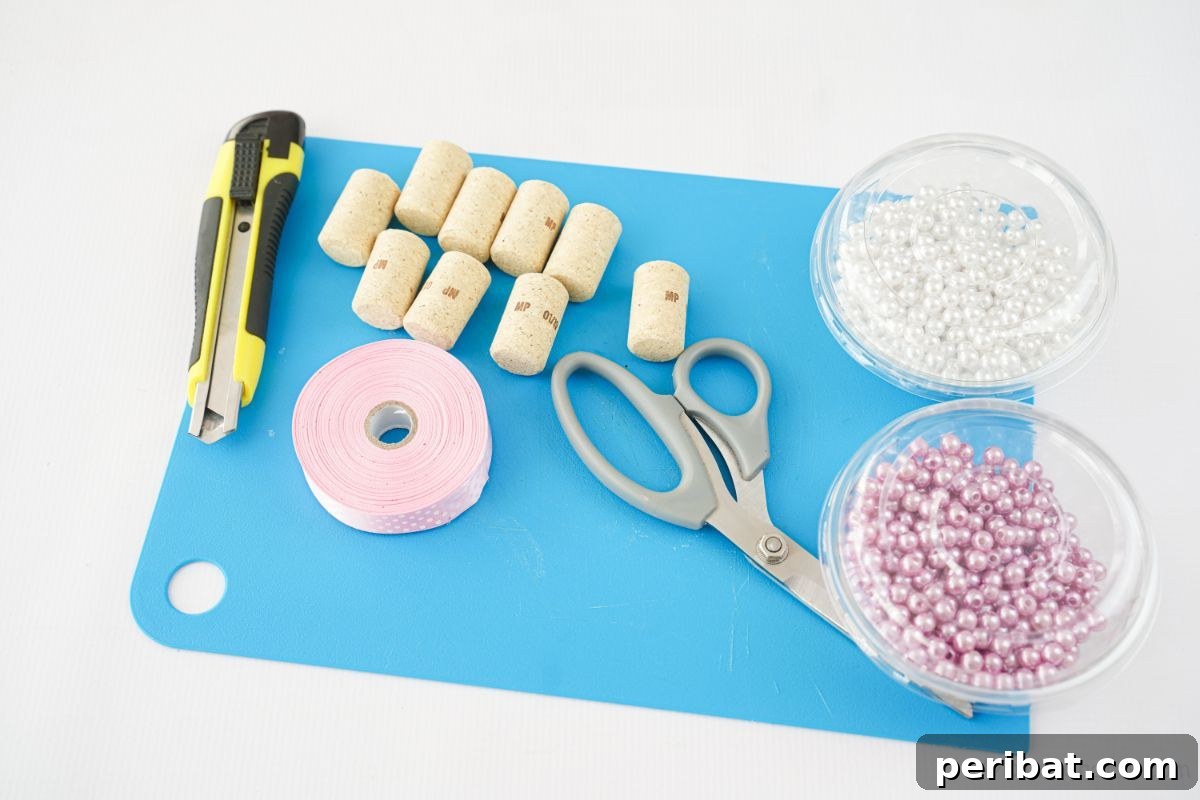 blue cutting mat with cork ribbon and beads, ready for Christmas crafting