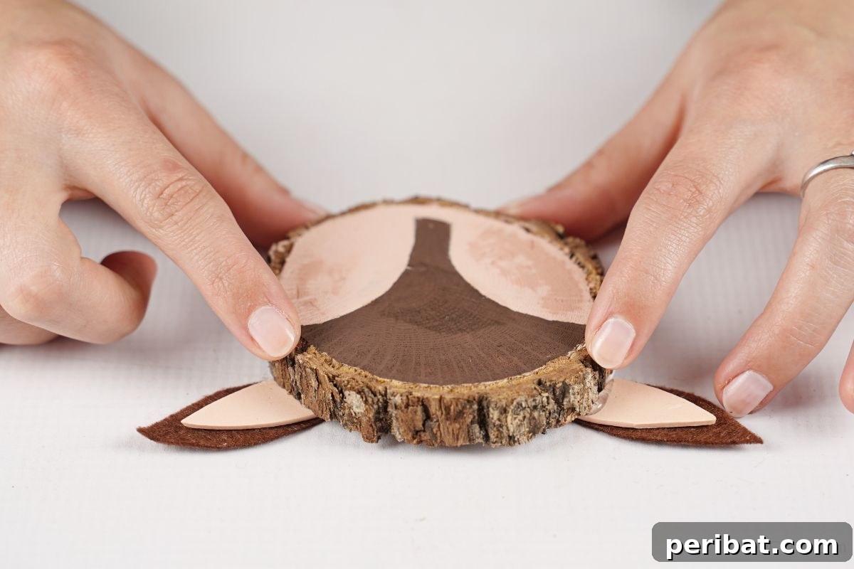 Naturally Charming Reindeer Wood Slice Decor 8 Reindeer ornament face with brown and cream paint on wood slice