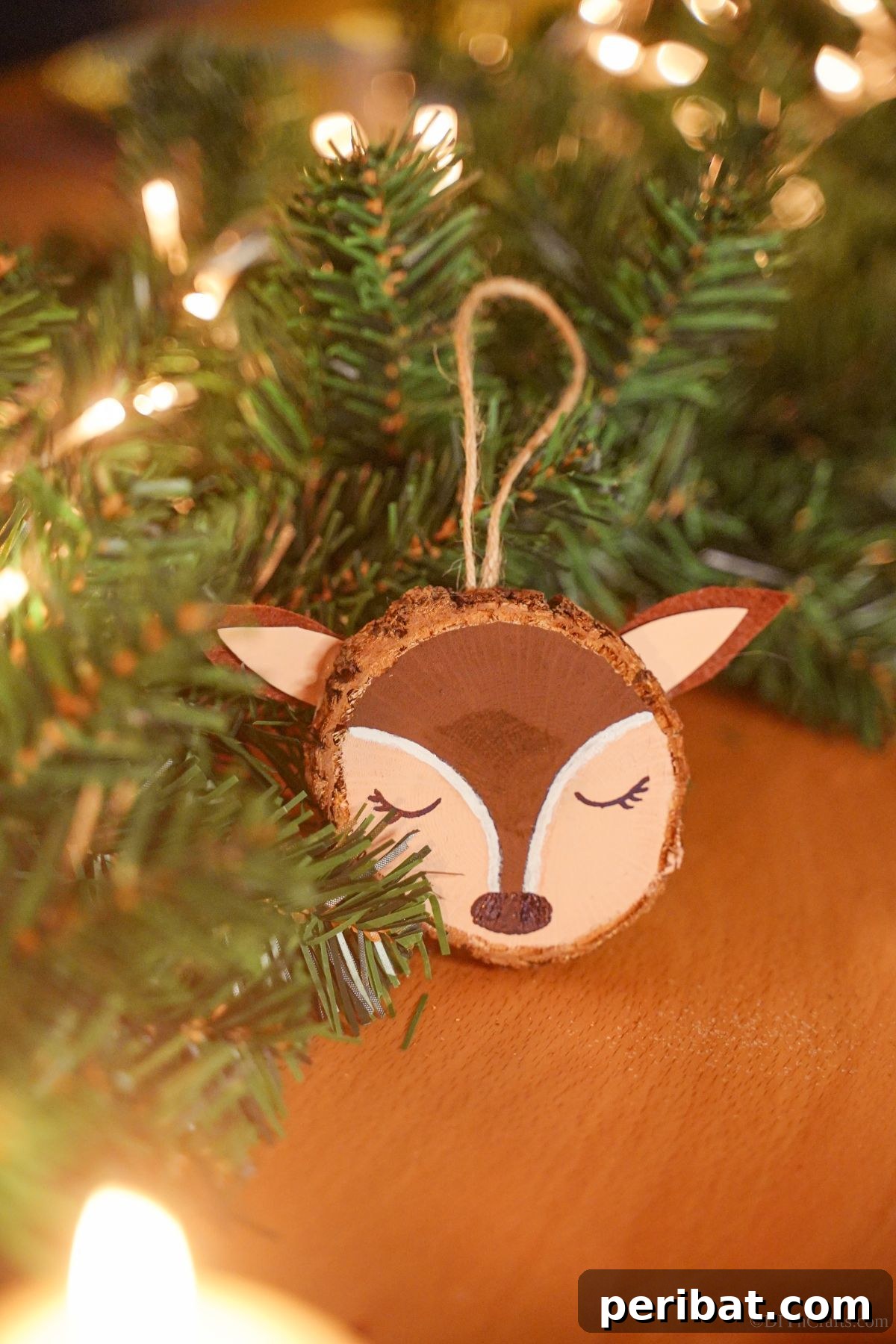 Naturally Charming Reindeer Wood Slice Decor 12 Wood table displaying a finished reindeer ornament against blurred greenery