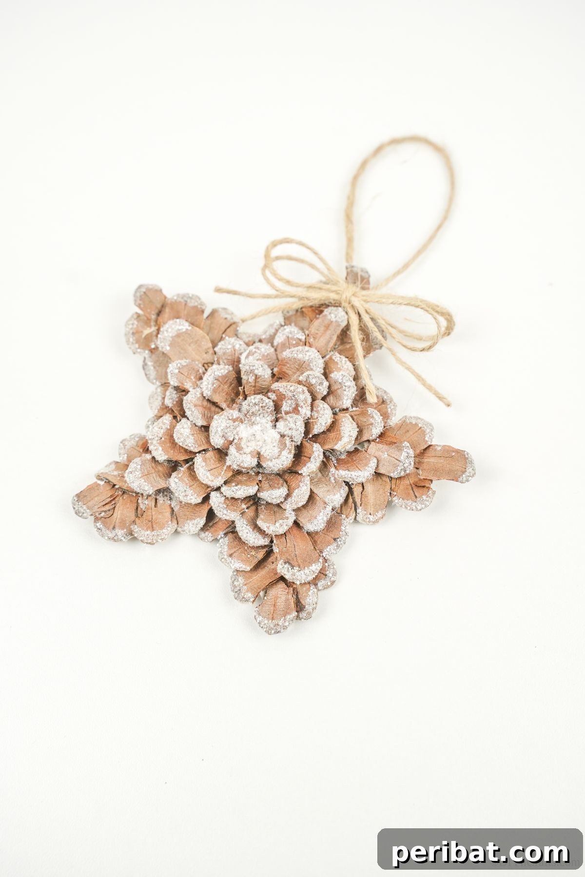 glitter star ornament on white table
