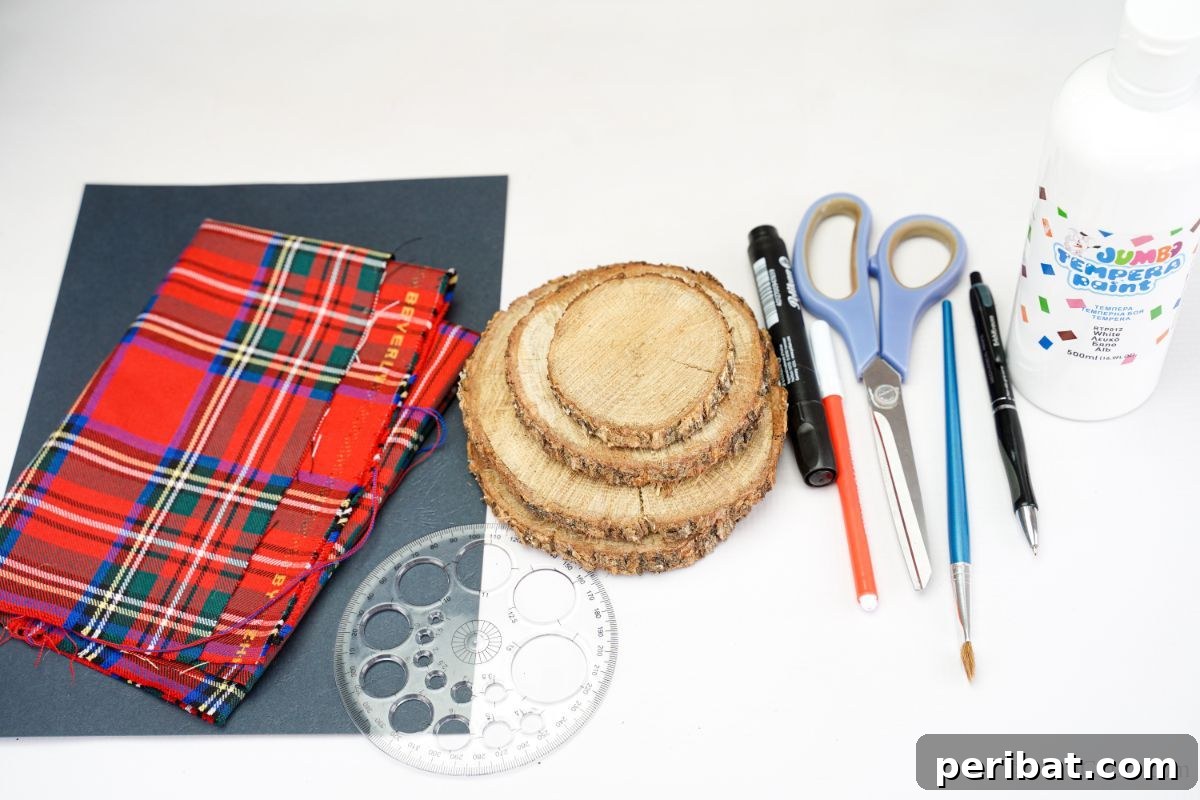 DIY Rustic Wood Slice Snowman Decor 4 Close-up of crafting supplies: plaid fabric, black paper, and unpainted wood slices laid out on a white table, ready for the snowman project