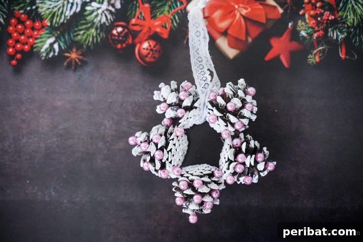 Glistening Bead-Adorned Pinecone Star 5 black holiday themed background behind pinecone star ornament