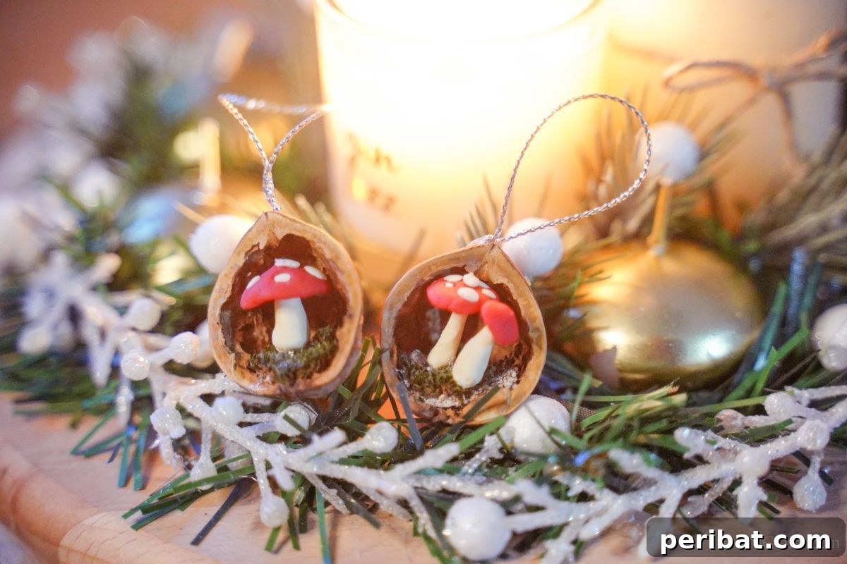 Mushroom ornaments crafted from walnut shells are neatly arranged on a table, surrounded by festive greenery and a lit candle, setting a cozy holiday ambiance.