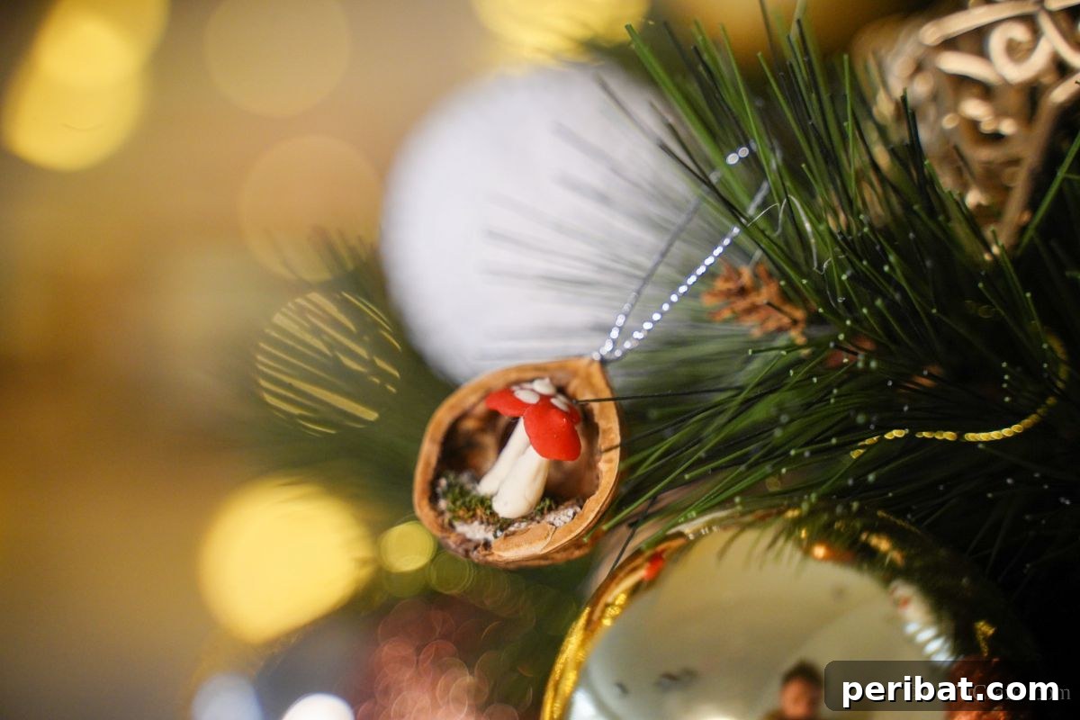 walnut shell ornament on tree by gold ornament