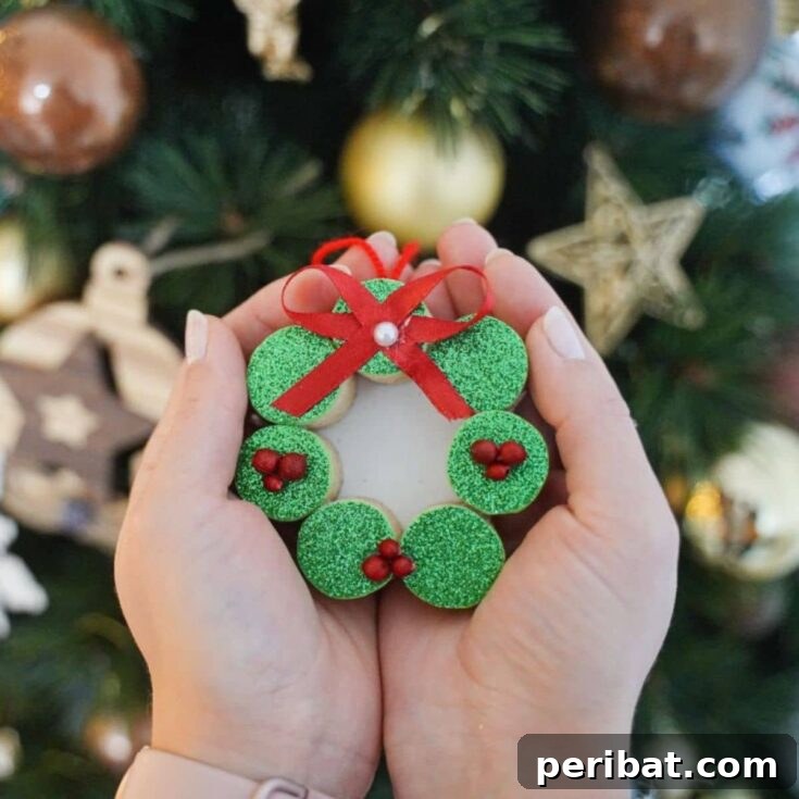 hands holding wine cork ornament by tree