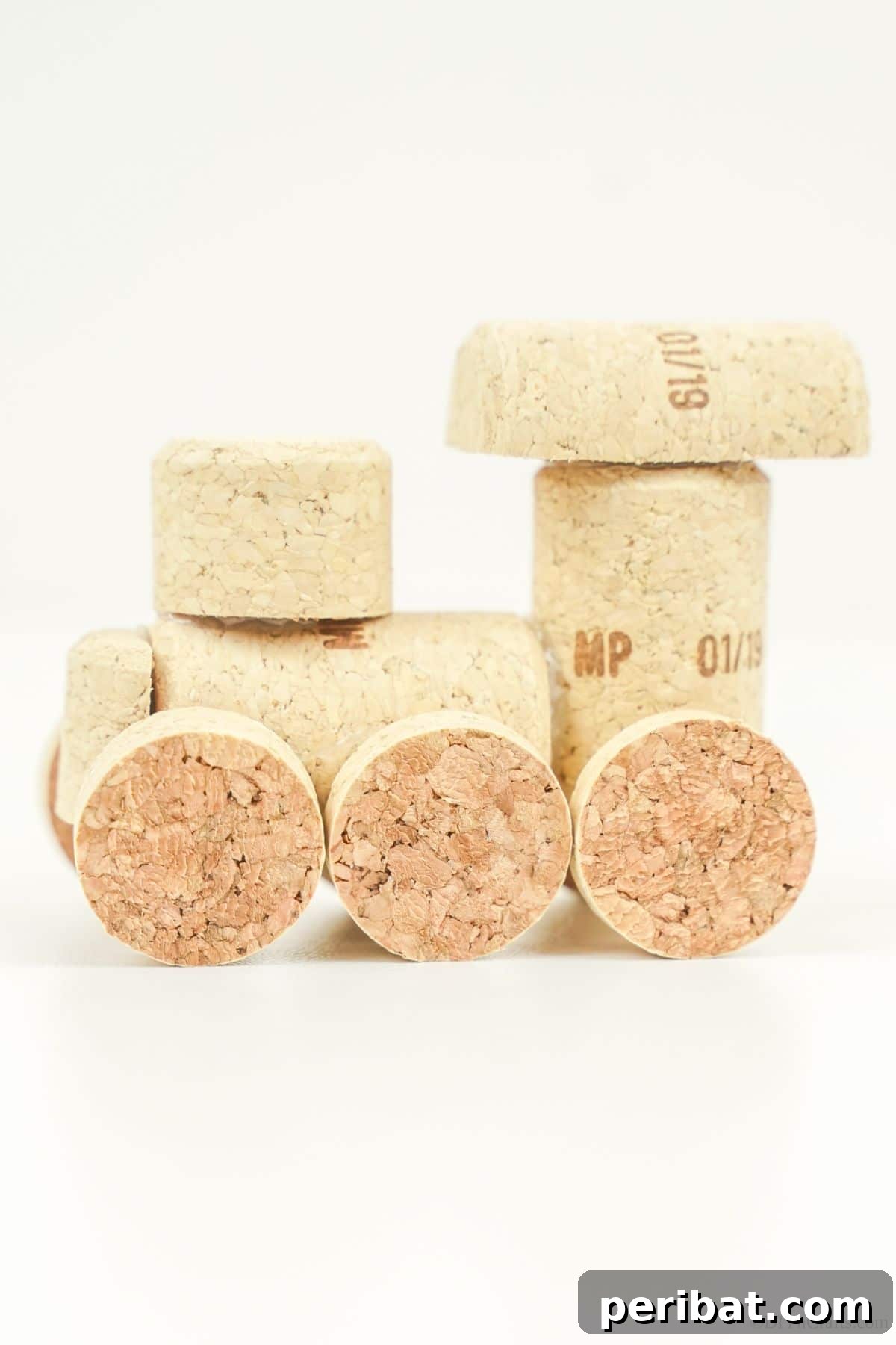 Wine Cork Express Christmas Ornament 18 A simple yet elegant wine cork train ornament displayed on a clean white table, highlighting its natural texture
